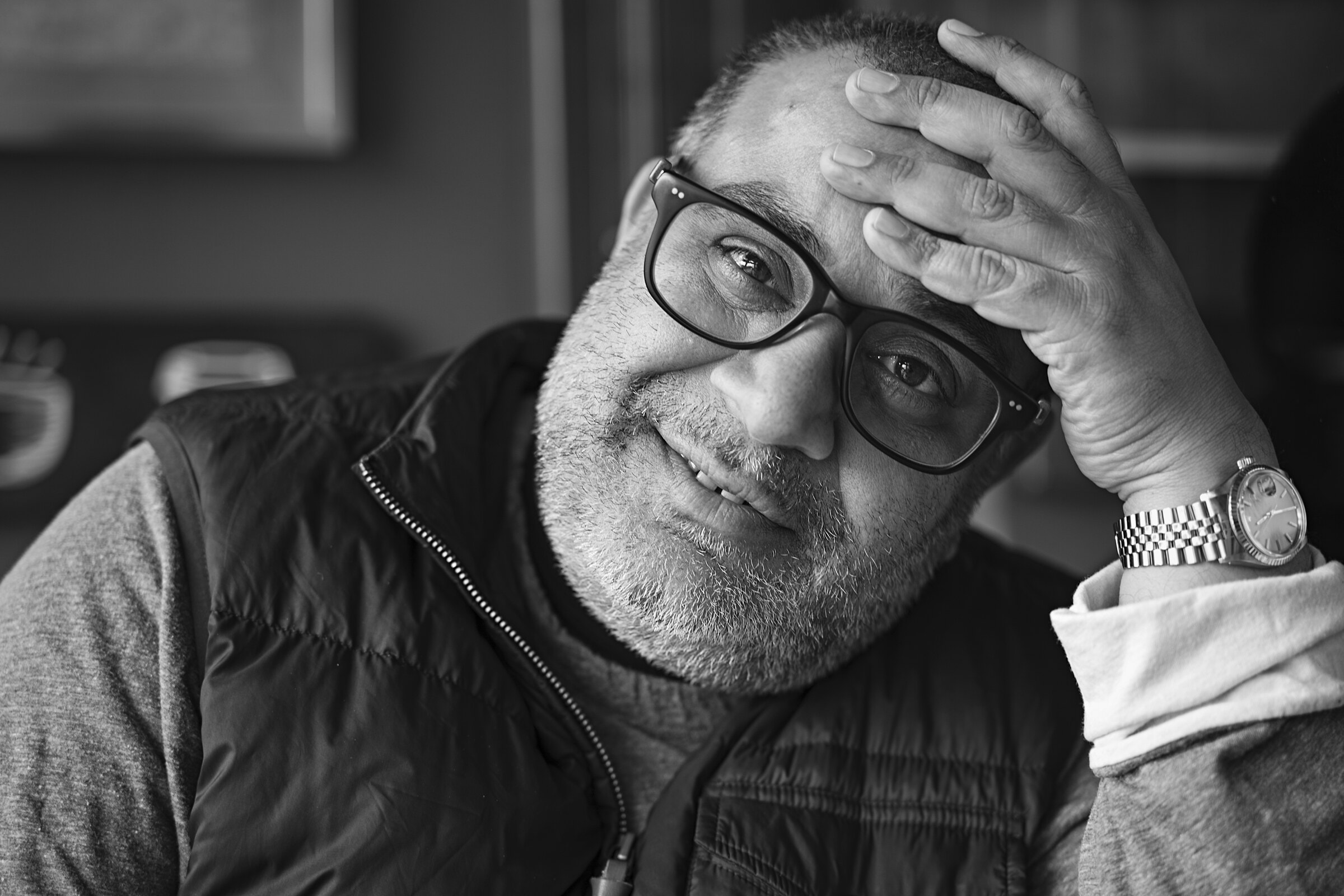 Om Malik, in black and white, resting his head against his hand